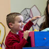 a child interacting with a researcher