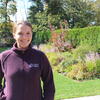 Cat Meholic standing in the formal gardens