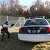 Non-Lethal Training Ammunition area, cadet behind a car