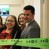 People cutting the ribbon to open the Small Business Development Center