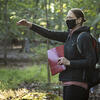 Instructor teaching class in the woods