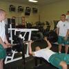 cadets bench pressing with spotters