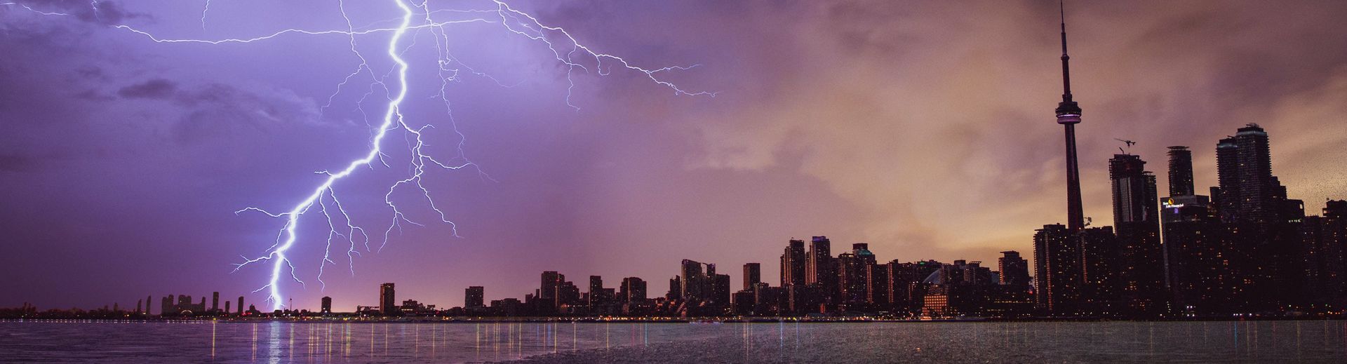 lightning strike near a city skyline