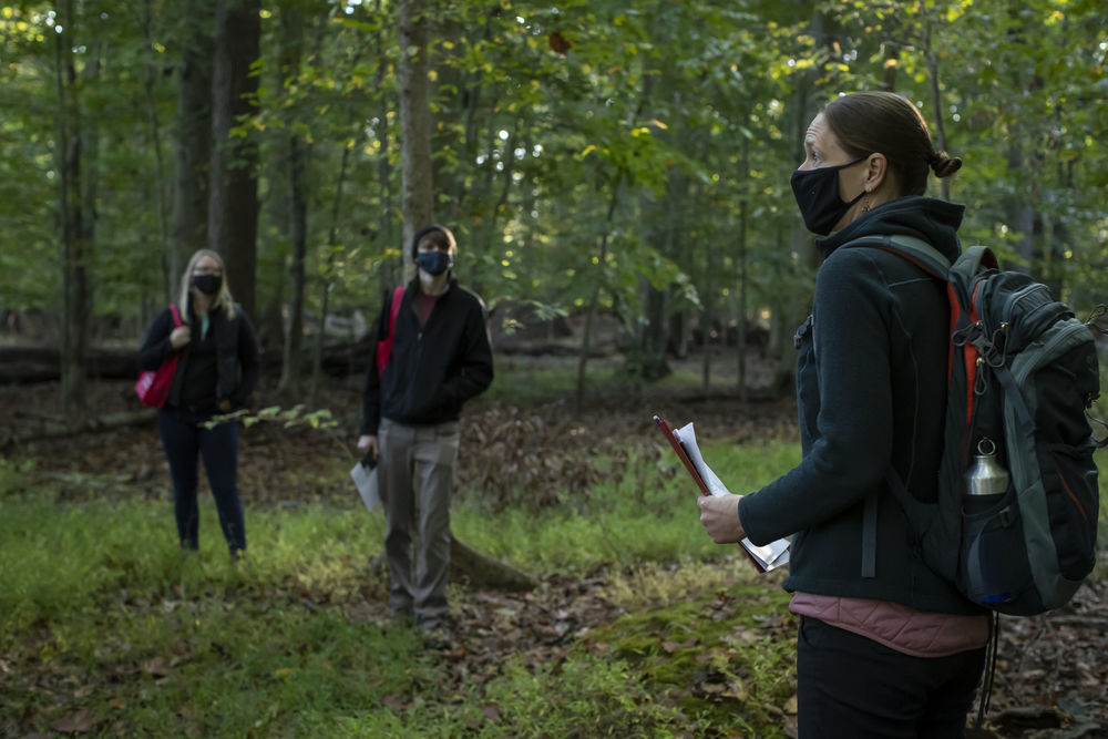 Amy Freestone teaching students in the forest 